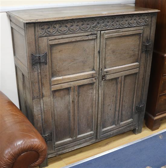 A 17th century oak cupboard, W.120cm